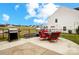 Back patio with grill, plenty of seating and grassy area in a well manicured yard at 2727 Cypress Oak Ln, Gastonia, NC 28056