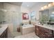 Spa-like bathroom with soaking tub, walk-in shower, and double vanity at 328 Sensibility Cir, Fort Mill, SC 29708