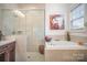 Elegant bathroom with soaking tub, shower, and modern vanity at 328 Sensibility Cir, Fort Mill, SC 29708