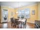 Bright dining room with hardwood floors and access to deck at 328 Sensibility Cir, Fort Mill, SC 29708