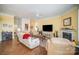 Bright living room with hardwood floors, fireplace, and access to kitchen at 328 Sensibility Cir, Fort Mill, SC 29708