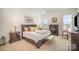 Spacious main bedroom with a king-size bed and lots of natural light at 328 Sensibility Cir, Fort Mill, SC 29708