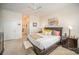 Main bedroom with king bed, dresser, and ensuite bathroom access at 328 Sensibility Cir, Fort Mill, SC 29708