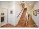 Elegant wooden staircase leading to the upper level of the home at 328 Sensibility Cir, Fort Mill, SC 29708