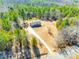 Aerial shot of home on a large lot with a long driveway surrounded by lush greenery at 3331 Center Rd, Chester, SC 29706