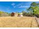 A spacious backyard featuring a brick home with a covered deck, offering a serene outdoor setting at 3331 Center Rd, Chester, SC 29706