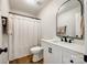 Bathroom featuring white vanity with black fixtures, and black framed mirror at 3331 Center Rd, Chester, SC 29706