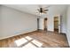 Neutral bedroom features wood-look flooring, ceiling fan, closet and attached bathroom at 3331 Center Rd, Chester, SC 29706