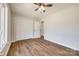 Bedroom with wood-look flooring, ceiling fan, closet and window at 3331 Center Rd, Chester, SC 29706