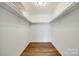 Walk-in closet features wood-look flooring and shelving at 3331 Center Rd, Chester, SC 29706