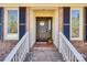 Inviting front door with brick steps, white railings, a welcome sign, and seasonal decor at 3331 Center Rd, Chester, SC 29706