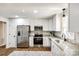 Updated kitchen with stainless steel appliances, granite countertops, and white cabinetry at 3331 Center Rd, Chester, SC 29706