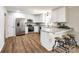 Modern kitchen featuring stainless steel appliances, white cabinets, and granite countertops at 3331 Center Rd, Chester, SC 29706