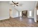 Spacious living room with a brick fireplace, wood floors, and plenty of natural light at 3331 Center Rd, Chester, SC 29706