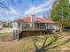 Back exterior showcasing a deck and a screened porch at 3447 Nesting Ln, Fort Mill, SC 29708