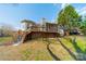 Expansive backyard featuring a wooden deck and screened-in porch, perfect for outdoor living and entertaining at 3447 Nesting Ln, Fort Mill, SC 29708