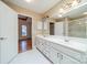 A spacious bathroom with double sinks, a large mirror, and access to the bedroom and glass shower at 3447 Nesting Ln, Fort Mill, SC 29708