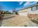 Side view of an attached garage and a long driveway at 3447 Nesting Ln, Fort Mill, SC 29708