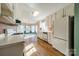 A bright kitchen with white cabinets and a bay window eating area provides a charming space at 3447 Nesting Ln, Fort Mill, SC 29708