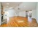 Spacious living room features a stone fireplace and hardwood floors, creating a warm atmosphere at 3447 Nesting Ln, Fort Mill, SC 29708