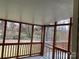 Relaxing screened porch with wooden railings, perfect for enjoying the outdoors with added protection at 3447 Nesting Ln, Fort Mill, SC 29708