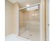 A walk-in shower features glass door, bench, skylight, and white tile at 3447 Nesting Ln, Fort Mill, SC 29708