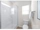 Clean bathroom with a shower and toilet at 3714 Small Ave, Charlotte, NC 28269