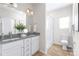 Double vanity bathroom with granite countertop and walk-in shower at 3714 Small Ave, Charlotte, NC 28269