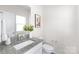 Modern bathroom with granite countertop and white cabinets at 3714 Small Ave, Charlotte, NC 28269