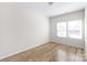 Simple bedroom with two windows and wood flooring at 3714 Small Ave, Charlotte, NC 28269