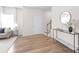 Bright entryway with hardwood floors, console table, and staircase at 3714 Small Ave, Charlotte, NC 28269