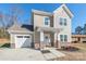 Two-story house with brick accents and a white door at 3714 Small Ave, Charlotte, NC 28269