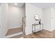 Modern staircase with a console table and mirror at 3714 Small Ave, Charlotte, NC 28269