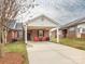 Inviting brick home featuring a covered carport and a cozy front patio with chairs at 3867 Azalea Trl, Denver, NC 28037