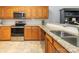 Well-equipped kitchen featuring stainless steel appliances, granite countertops, and classic wood cabinetry at 3867 Azalea Trl, Denver, NC 28037