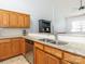 Well-lit kitchen featuring wooden cabinetry, granite countertops, stainless steel appliances, and an undermount sink at 3867 Azalea Trl, Denver, NC 28037