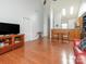 Spacious living room with vaulted ceiling, hardwood floors, and a view of the eat-in kitchen at 3867 Azalea Trl, Denver, NC 28037