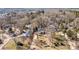 Aerial view of a home with a driveway and a surrounding yard in a wooded neighborhood at 3995 Burton Ln, Denver, NC 28037