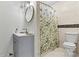 Classic bathroom featuring a vanity with a white countertop and a shower with a stylish curtain at 3995 Burton Ln, Denver, NC 28037