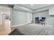 Bedroom featuring wood floors and a view of the yard through sliding glass doors at 3995 Burton Ln, Denver, NC 28037