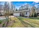 Beautiful home exterior showcasing the garage, well-maintained lawn, and charming front entrance at 3995 Burton Ln, Denver, NC 28037