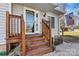 Lovely front entrance with wooden steps, white door, and well-kept landscaping at 3995 Burton Ln, Denver, NC 28037