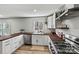 Clean kitchen features butcher block countertops and stainless steel appliances at 3995 Burton Ln, Denver, NC 28037