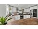 Bright kitchen with a modern refrigerator and stainless steel appliances at 3995 Burton Ln, Denver, NC 28037