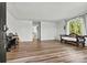 Bright living room with hardwood floors, natural light, and an open layout at 3995 Burton Ln, Denver, NC 28037