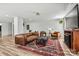 Bright living room with a decorative rug, nice leather furniture and a cozy fireplace at 3995 Burton Ln, Denver, NC 28037