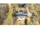 Aerial view of a home with pool and detached garage, showcasing a large backyard at 4001 Carmel Acres Dr, Charlotte, NC 28226