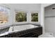 Spa-like bathroom with a large soaking tub and walk-in shower at 4001 Carmel Acres Dr, Charlotte, NC 28226