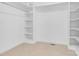 Walk-in closet with built-in shelves and ample storage space at 4001 Carmel Acres Dr, Charlotte, NC 28226