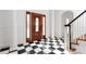 Grand foyer with black and white tile flooring, a wood front door with glass panels, and white columns at 4001 Carmel Acres Dr, Charlotte, NC 28226